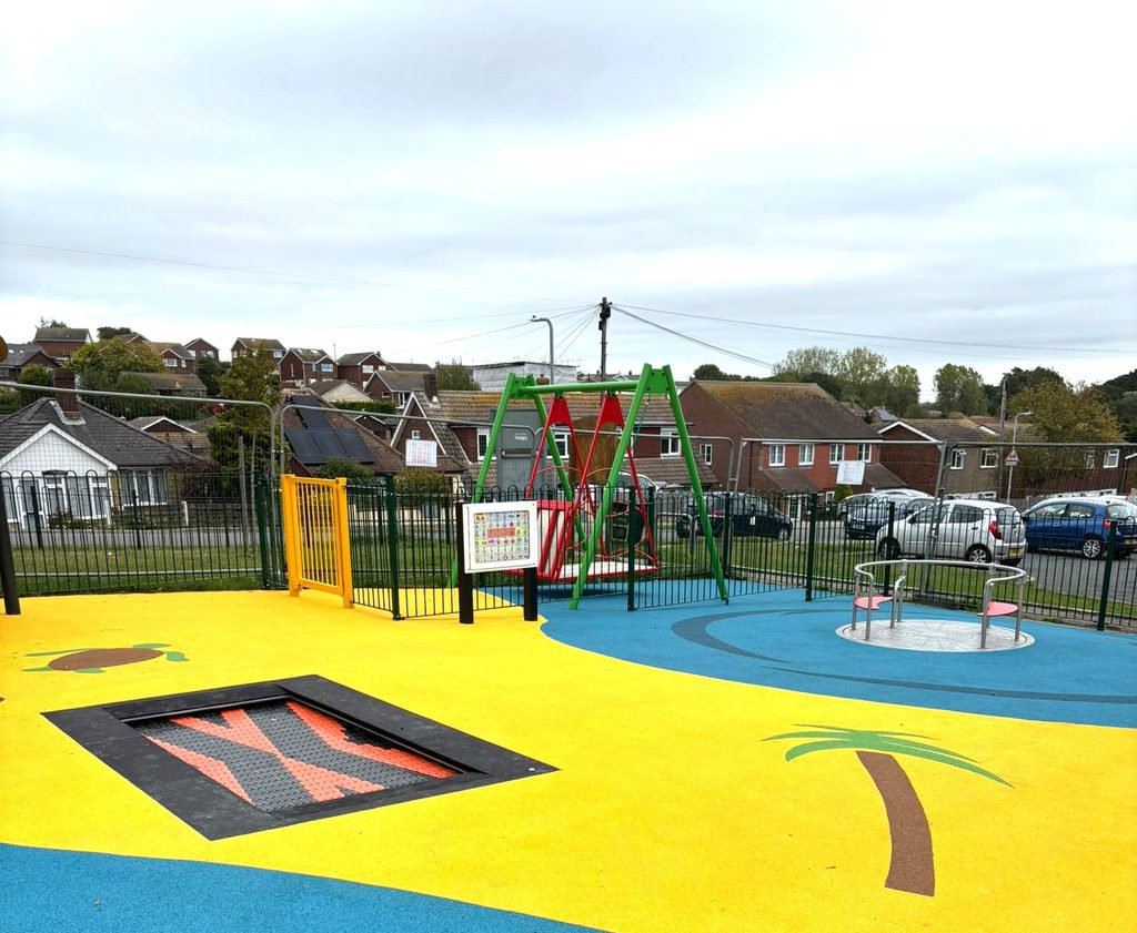 A view of some of the play equipment at Pebsham Inclusive Play Area, with a view of Seabourne Road in the background.
